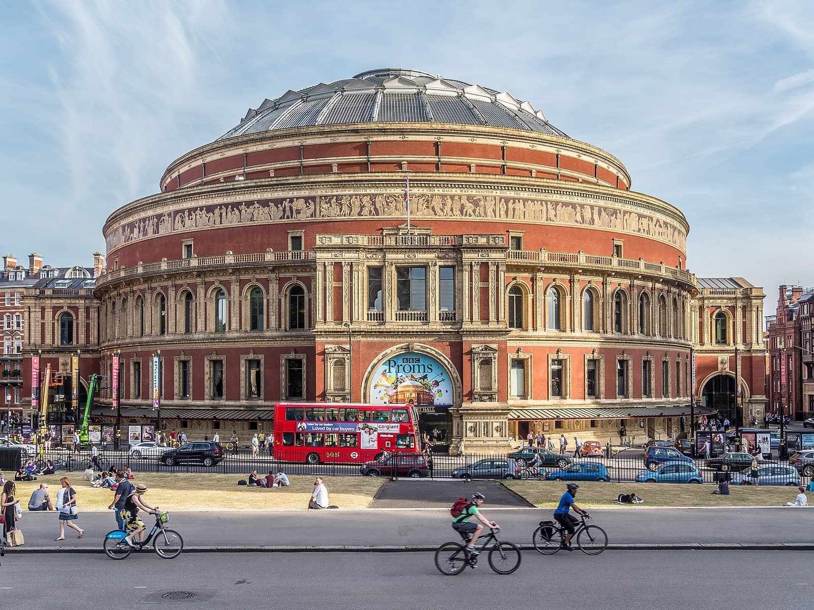 The Royal Albert Hall from Kensington Gore, with a red London bus passing
