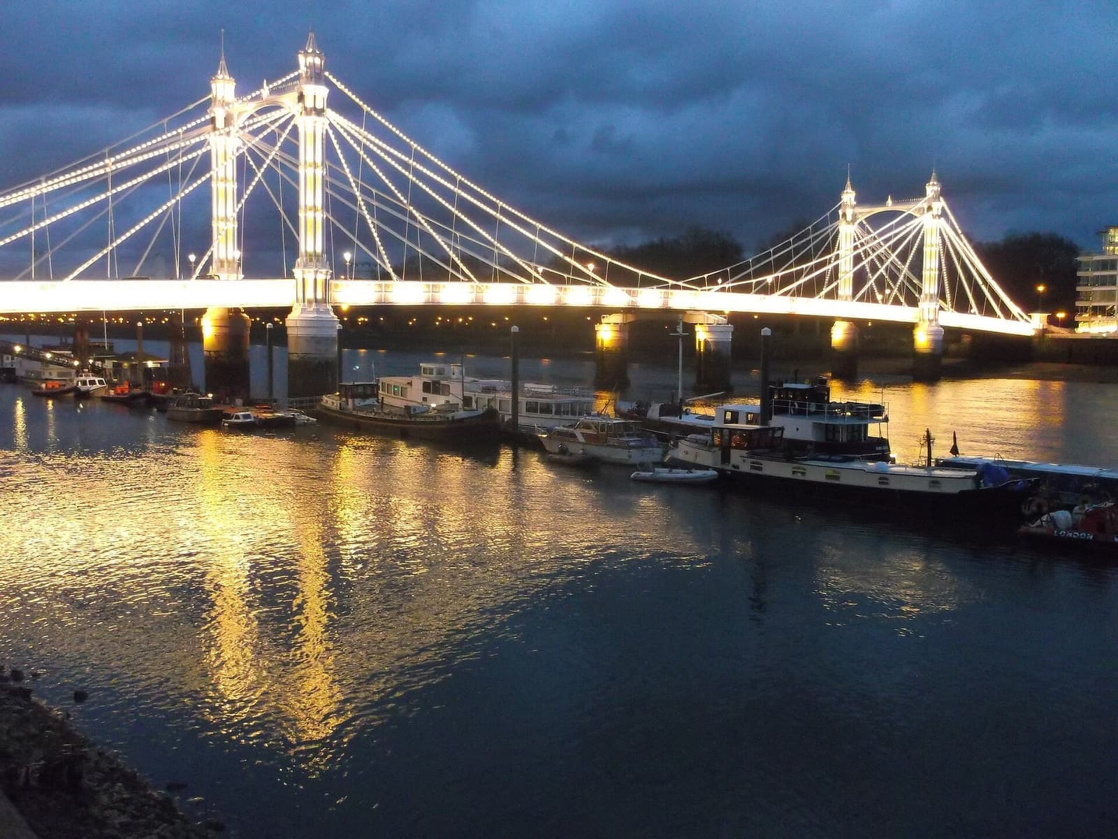Albert Bridge lit up at night over the Thames