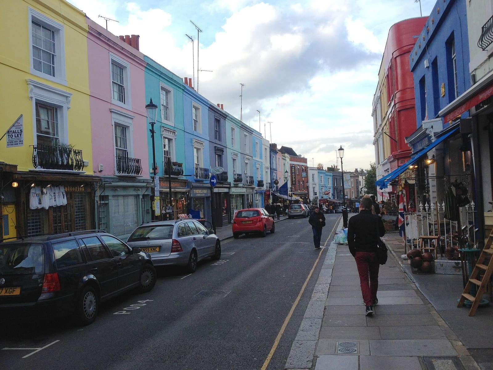 Pastel shopfronts and terraces along Portobello Road
