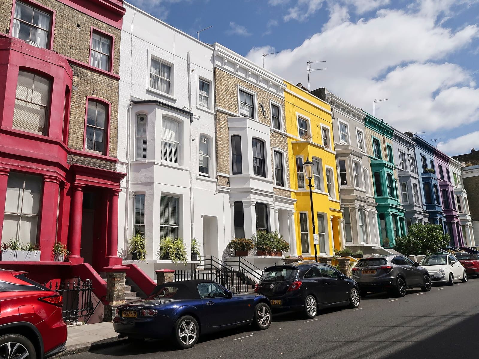 A row of brightly painted houses on Lancaster Road, Notting Hill