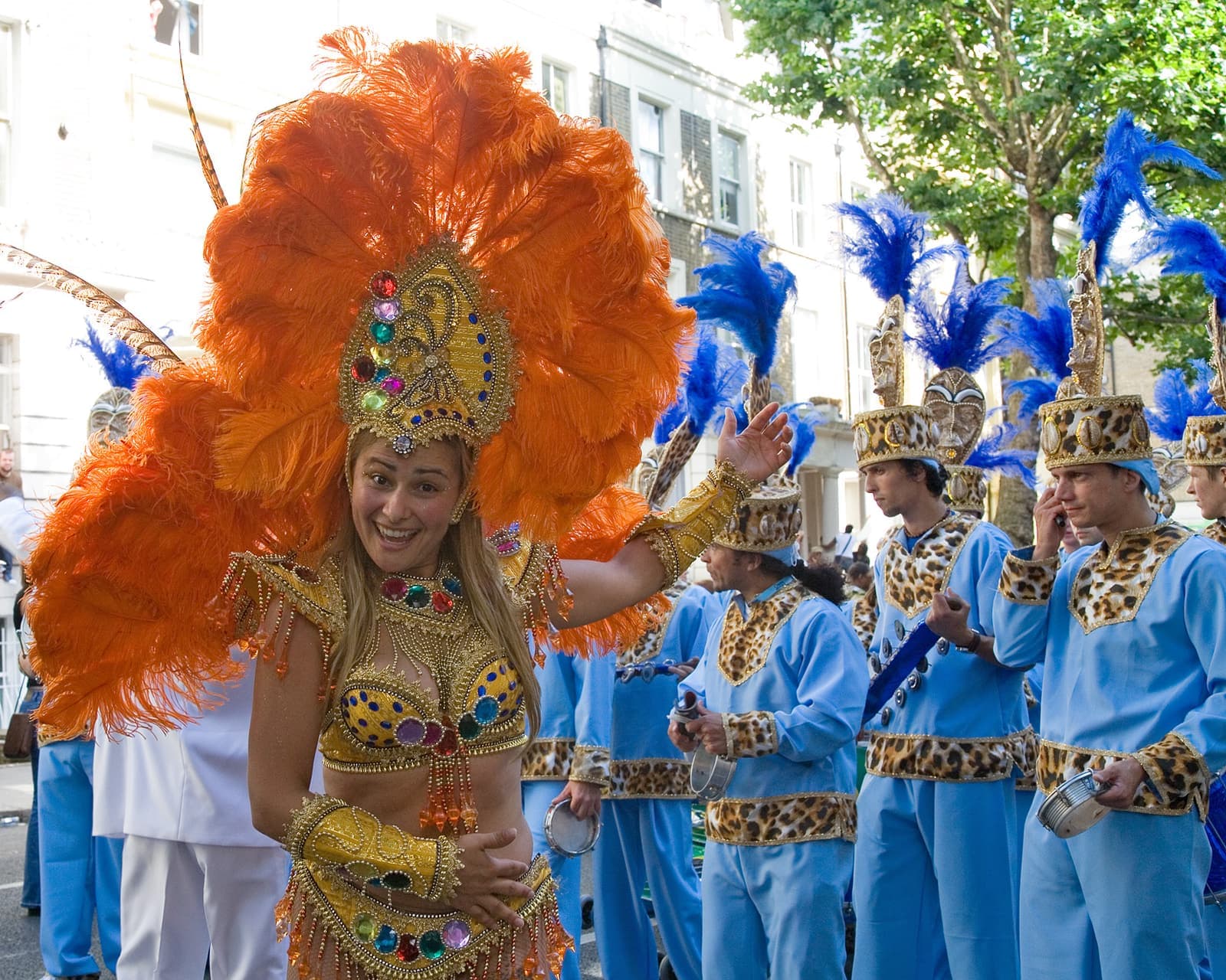 Dancers in feathered costumes at Notting Hill Carnival