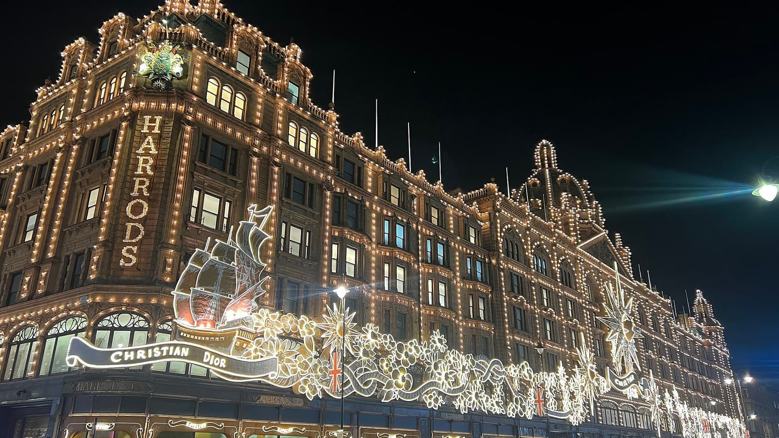 Harrods covered in Christmas lights at night